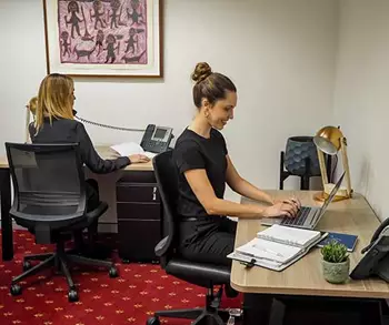 Coworking freedom in Emirates Towers, Duba, were two ladies are working 