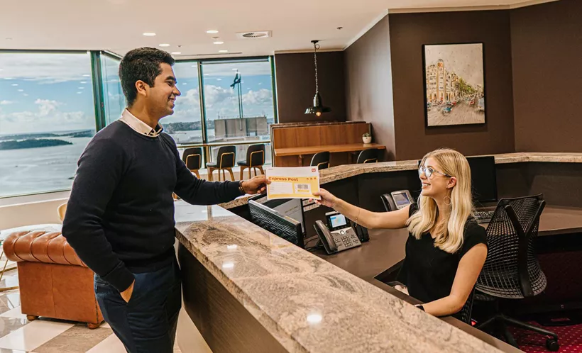 Efficient mail handling by professional receptionists in a premium serviced office with stunning waterfront views.